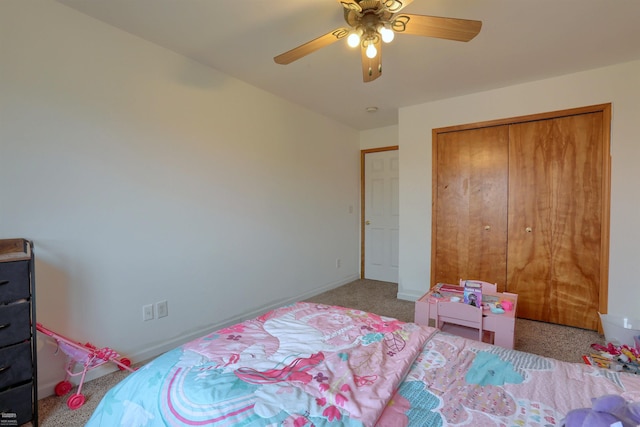 bedroom with ceiling fan, a closet, and light colored carpet