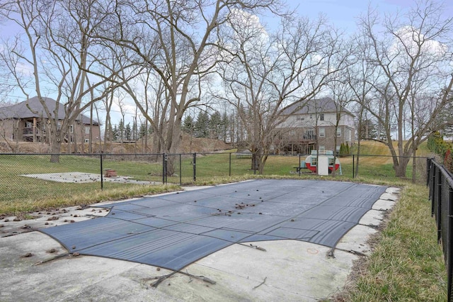 view of pool with a yard