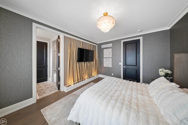 bedroom featuring crown molding and dark hardwood / wood-style floors