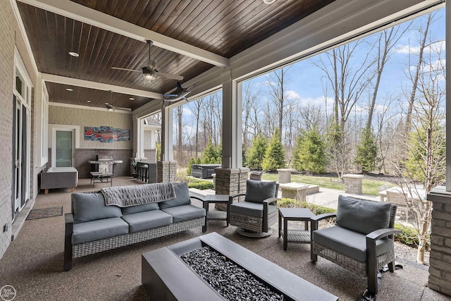 view of patio / terrace with an outdoor living space and ceiling fan