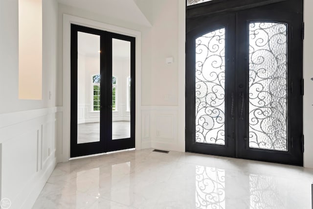 tiled foyer entrance with french doors