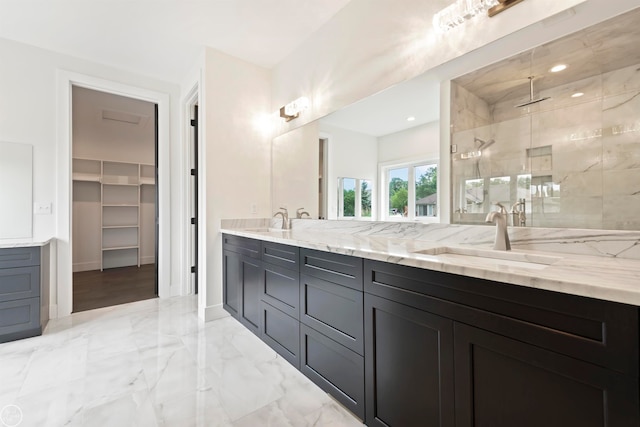 bathroom with tiled shower, tile floors, and dual vanity