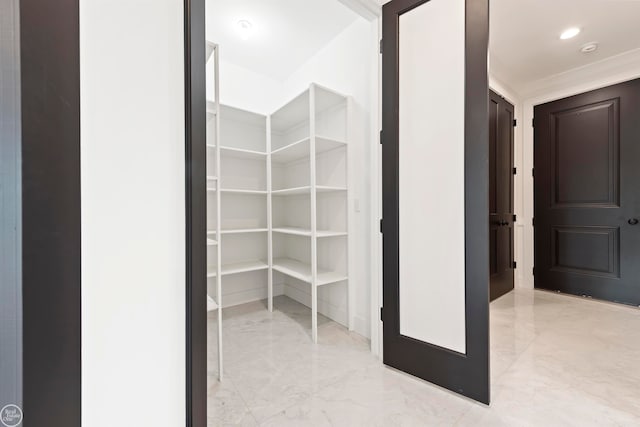 spacious closet featuring light tile floors