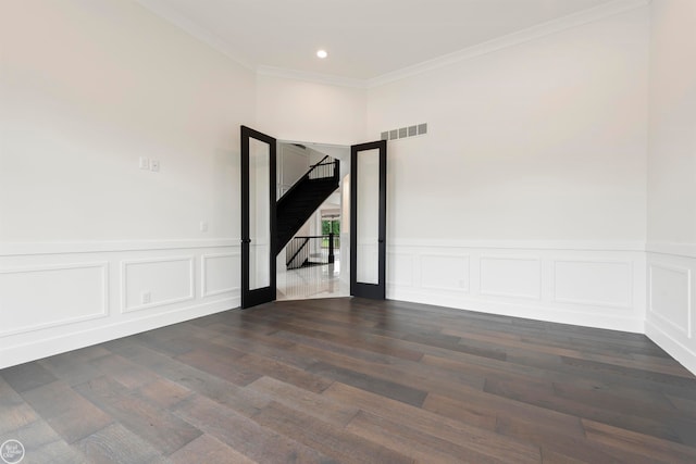 unfurnished room featuring dark hardwood / wood-style flooring and crown molding