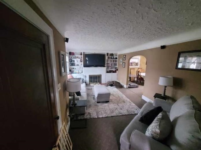 living room with a textured ceiling