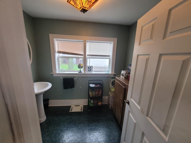 bathroom with sink and tile floors