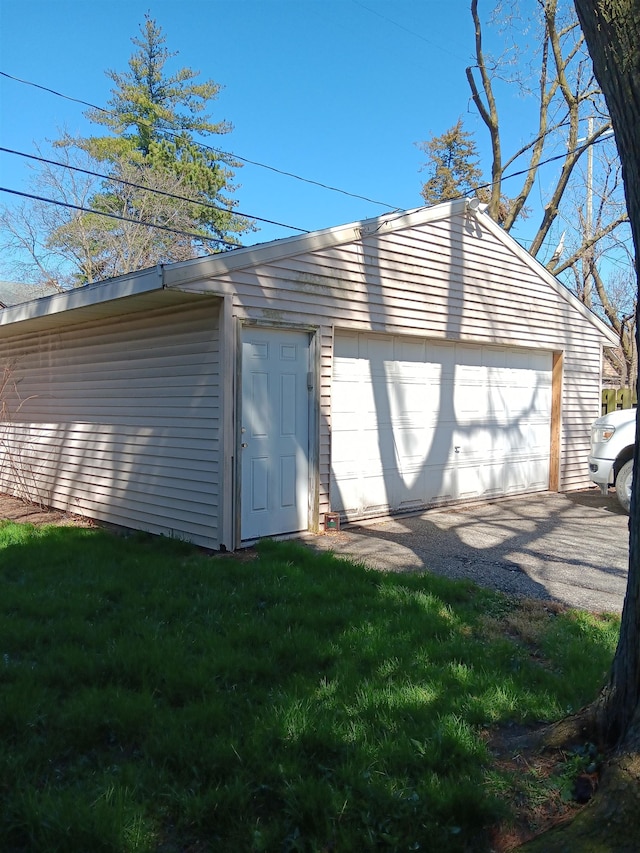 garage with a lawn