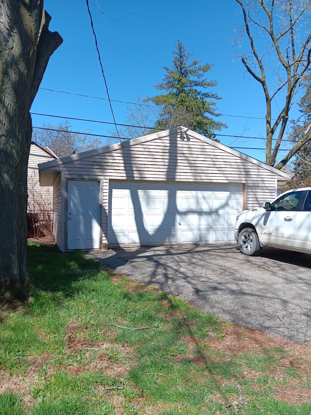 exterior space with an outdoor structure and a garage