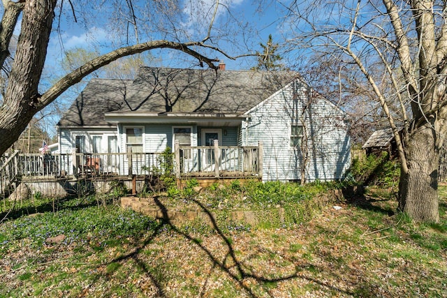 back of house featuring a deck