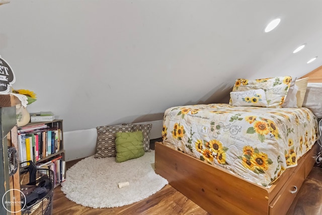 bedroom with dark hardwood / wood-style floors