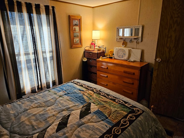 bedroom with crown molding