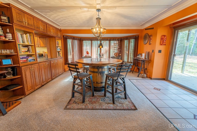 dining space with a notable chandelier, crown molding, and light colored carpet