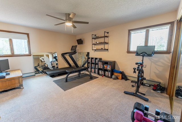 exercise area with ceiling fan, carpet floors, a textured ceiling, and a baseboard heating unit