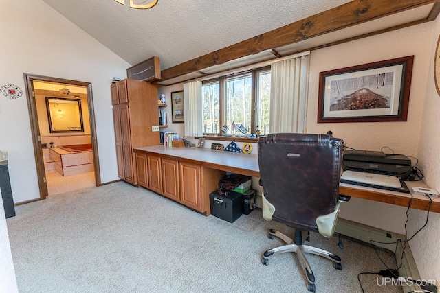 carpeted home office with vaulted ceiling and a textured ceiling