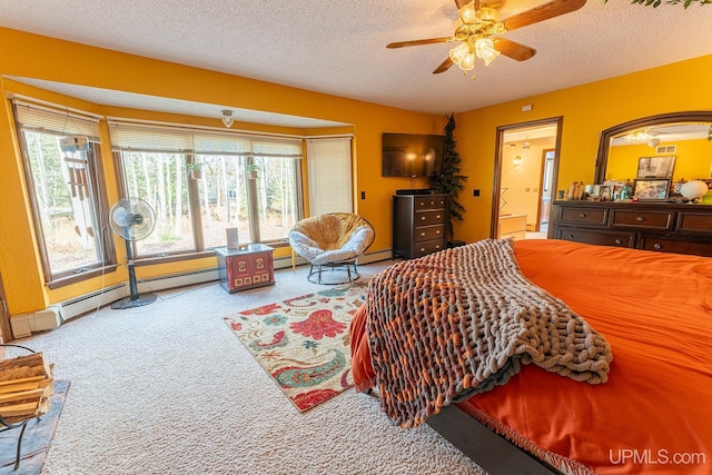 carpeted bedroom with a baseboard radiator, ensuite bathroom, a textured ceiling, and ceiling fan