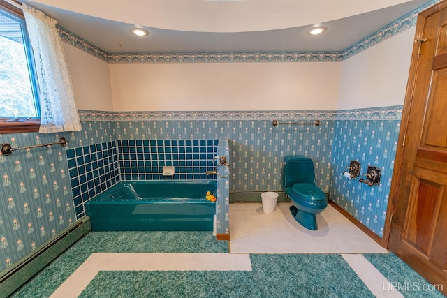 bathroom featuring a baseboard radiator, toilet, a bathing tub, and tile patterned flooring