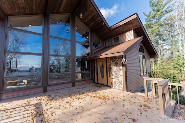 property entrance with a deck