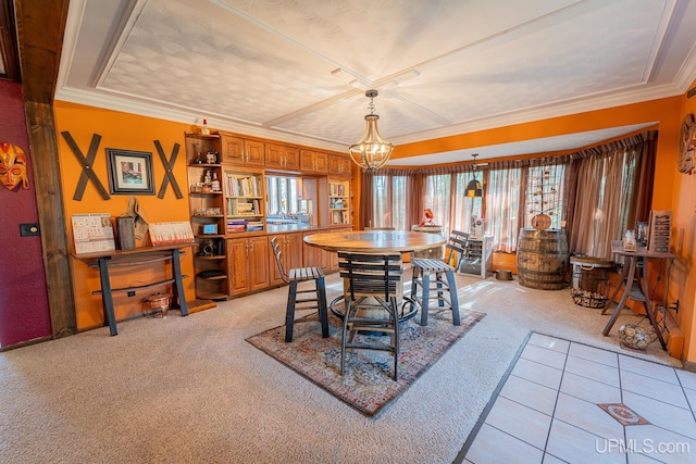 carpeted dining room featuring an inviting chandelier and ornamental molding