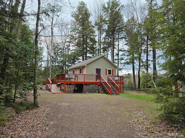 back of house with a wooden deck