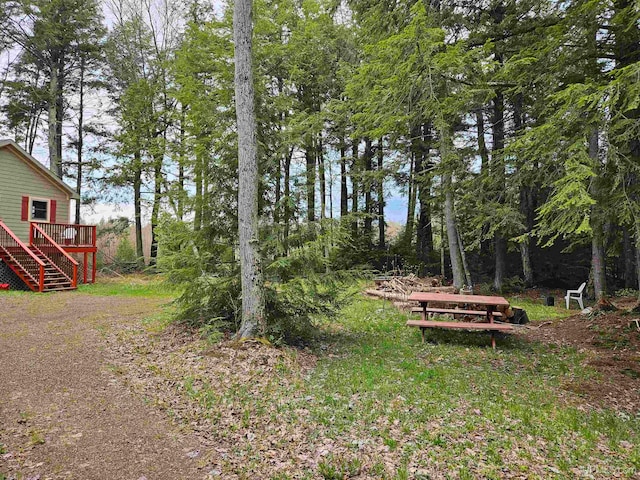 view of yard featuring a wooden deck