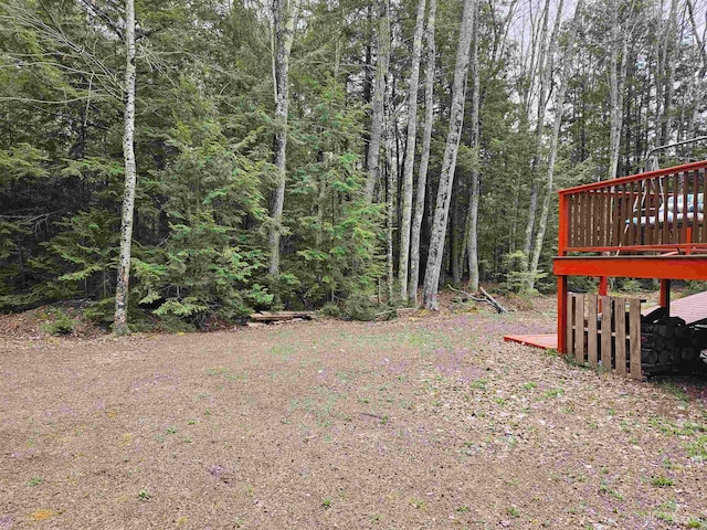 view of yard featuring a wooden deck