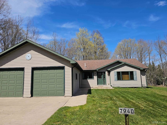 single story home featuring a garage and a front lawn