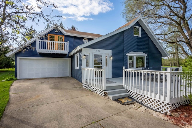 view of front facade featuring a deck and a garage