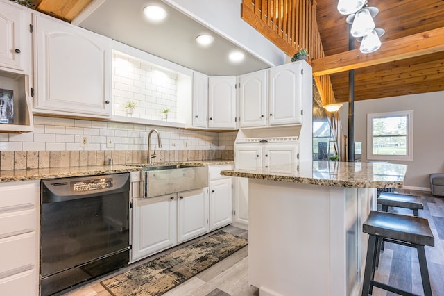 kitchen with light stone countertops, backsplash, wood ceiling, and dishwasher