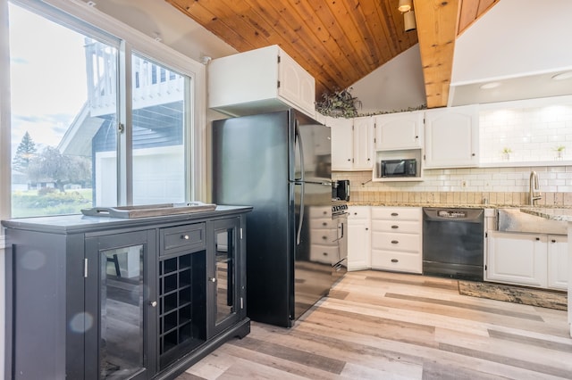 kitchen featuring light hardwood / wood-style floors, tasteful backsplash, vaulted ceiling with beams, black appliances, and white cabinets