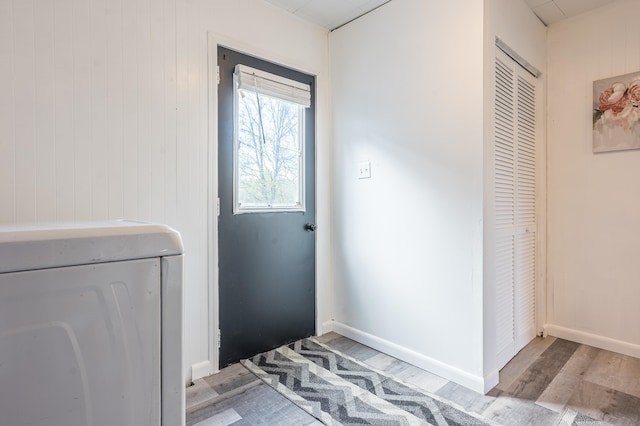 doorway with wood-type flooring