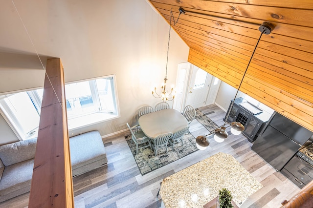 living room with vaulted ceiling and wood-type flooring