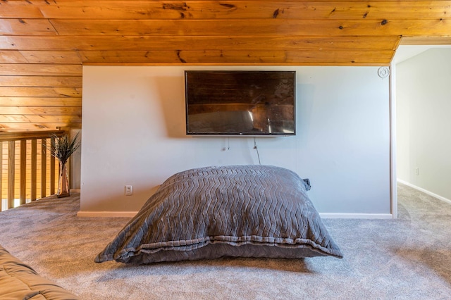 unfurnished bedroom with carpet flooring and wood ceiling