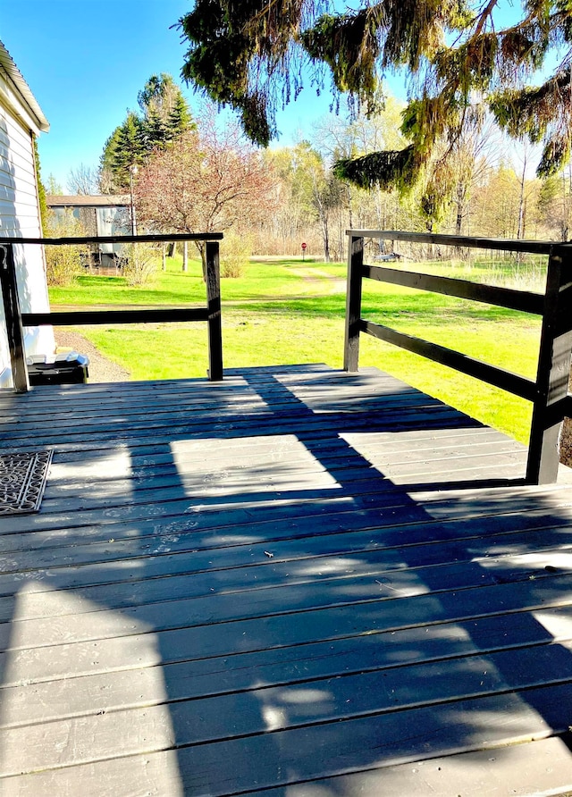 wooden deck with a yard