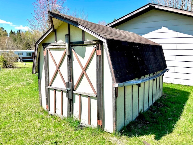 view of shed / structure with a lawn