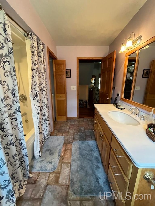 bathroom with shower / bathtub combination with curtain, tile flooring, and vanity