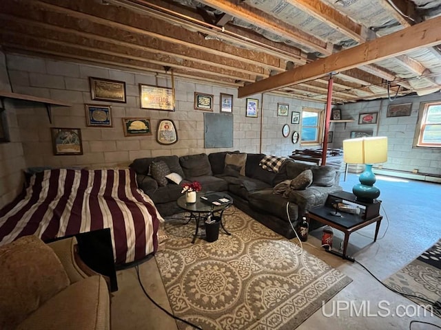 living room featuring a baseboard radiator and concrete floors