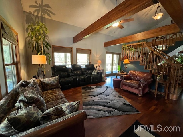 living room with a wealth of natural light, vaulted ceiling with beams, and wood-type flooring