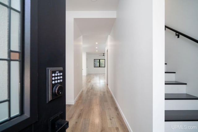 hall with light hardwood / wood-style flooring