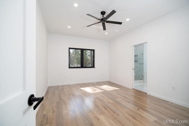 unfurnished room featuring ceiling fan and light hardwood / wood-style floors