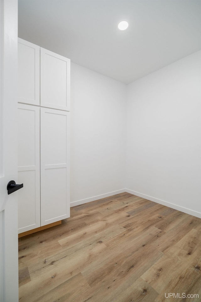 unfurnished room with light hardwood / wood-style floors