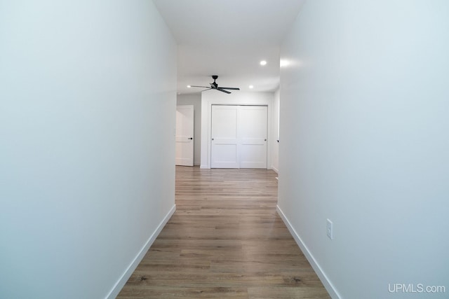 corridor featuring light hardwood / wood-style floors