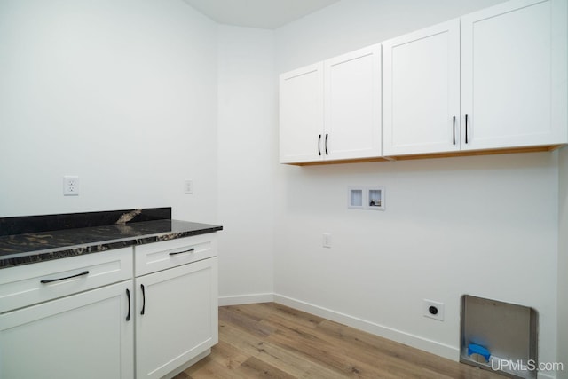 laundry area with washer hookup, cabinets, light hardwood / wood-style floors, and electric dryer hookup