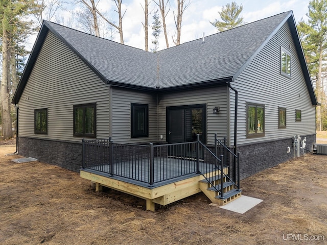 back of house with a wooden deck