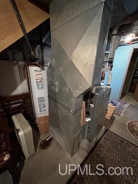 utility room featuring gas water heater