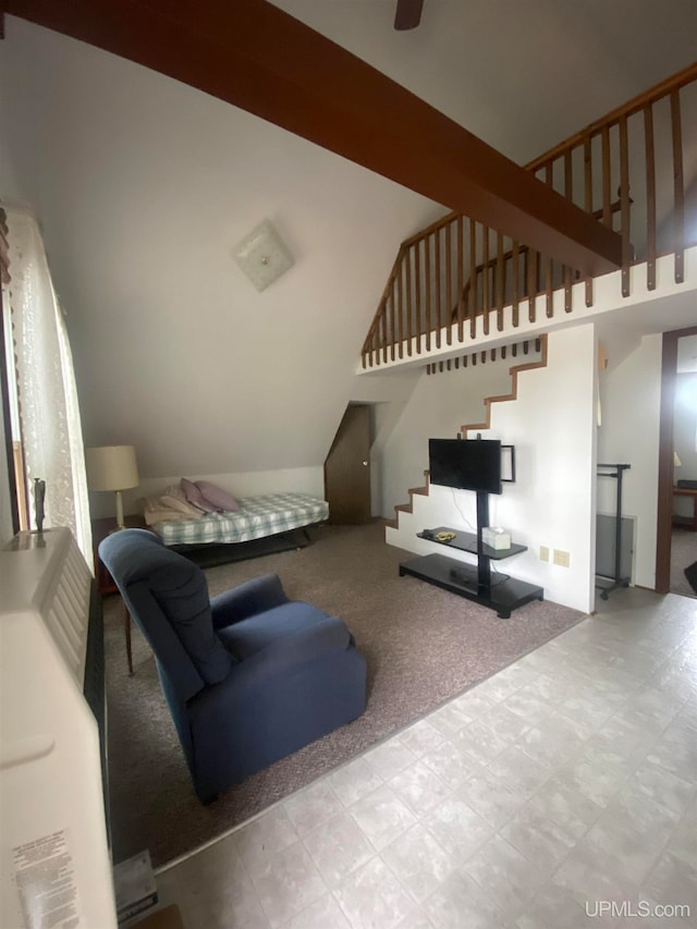 carpeted living room with lofted ceiling