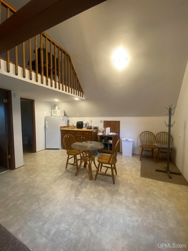 dining room with lofted ceiling