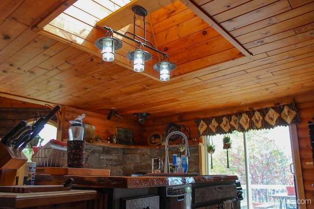 kitchen featuring pendant lighting and wooden ceiling