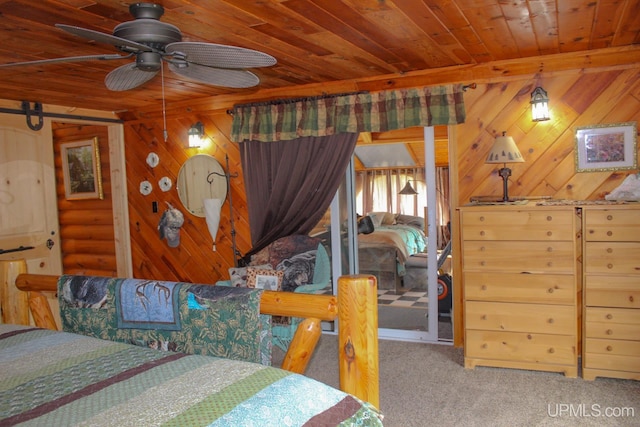 carpeted bedroom with ceiling fan, wood walls, and wood ceiling