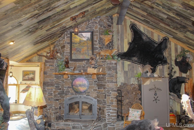 unfurnished living room featuring a fireplace and vaulted ceiling with beams