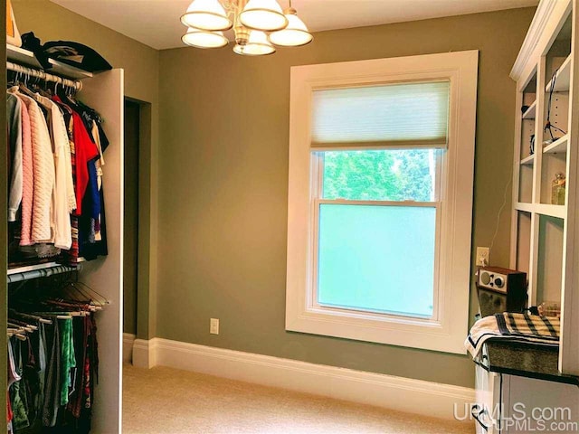 interior space featuring a chandelier and a healthy amount of sunlight